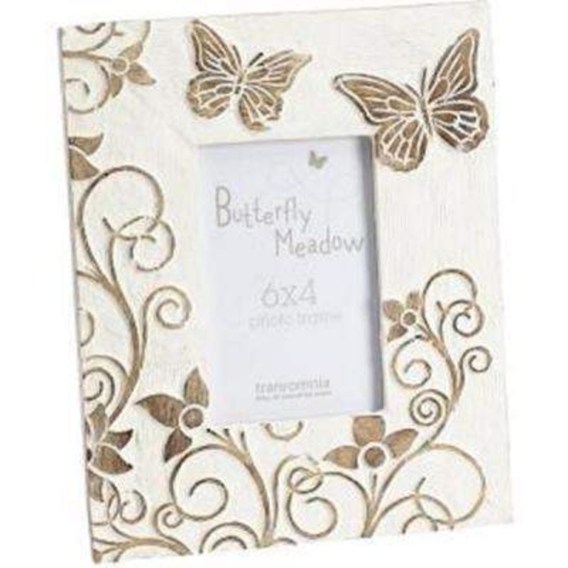 Carved Wood Butterfly Frame by Transomnia. Shabby chic distressed look photo frame. Carved wood painted cream with butterfly design. Has stand on the back so that can be stood on a flat surface. This picture frame holds photo size 6x4